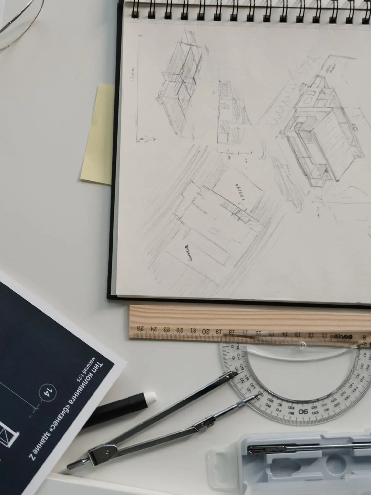 Architectural sketches, blueprints and drawing tools on a desk