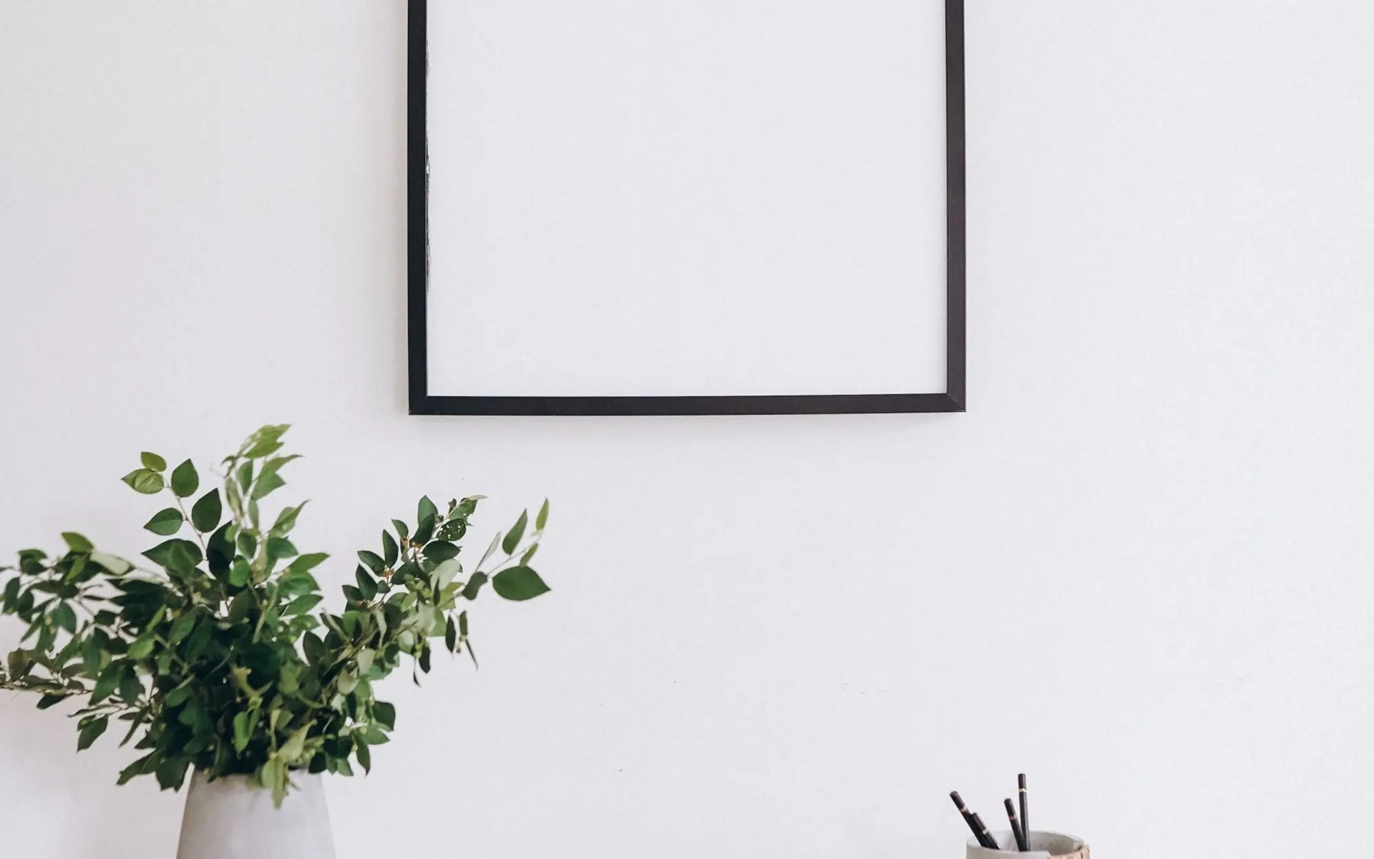 A minimalist wooden desk in an office interior